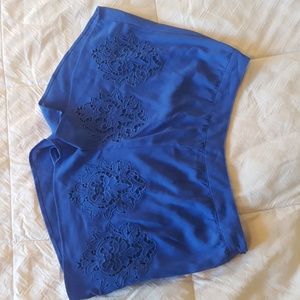 Blue lined shorts, with a side zipper.